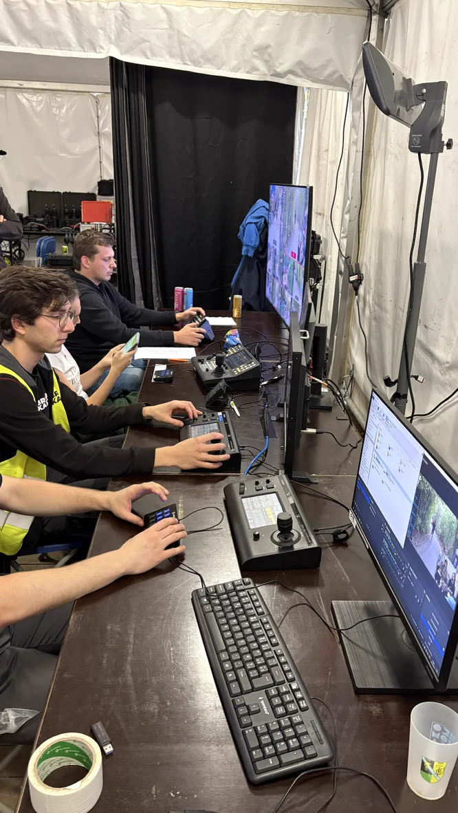 Crew operating PTZ cameras side by side in the production tent